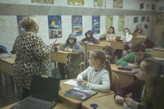 Pupils in a classroom in one of the metro schools in Kharkiv. Classrooms were set up in various