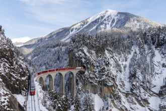 Rhaetian Railway train at the famous Landwasser Viaduct on the Albula railway Stadler Rail