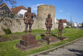 Sculptures People made of iron by Zbigniew Fraczkiewicz on the historic town wall of Hattingen,