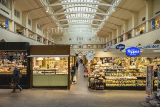 Various market stalls with supra-regional delicatessen products in the historic market hall in