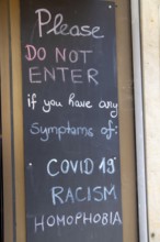 Display in front of a pub in Germany: Guests are warned in English that they are not welcome with