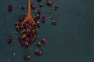 Pink Tea, Damask rose buds, wooden spoon, top view, no people