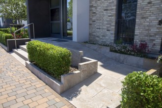 Access to the apartment block with barrier-free wheelchair ramp