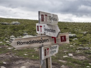 Signpost at trail to mountain ridge Romsdalseggen, famous hiking trip near Andalsnes, Norway,