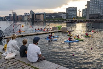 Summer evening in Copenhagen, at the harbour, Islands Brygge, people celebrating, eating, drinking,