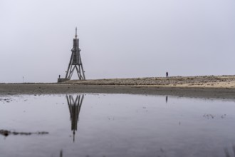 Thick fog in winter, hangs over the mouth of the Elbe into the North Sea, navigation mark and