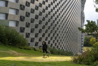 CopenHill, waste incineration plant and artificial ski slope, skiing with a view of the ski lift,