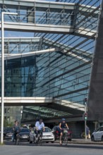 Cyclists on the cycle path on Christians Brygge Street, at the Black Diamond, Danish Royal Library,