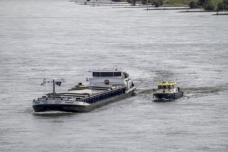 Water police boat sailing alongside a cargo ship on the Rhine near Duisburg, WSP 12, a police