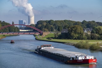 Cargo ship on the Rhine-Herne Canal, at the water cross of the Emscher, bridge of Wartburgstraße,