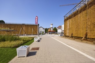 Graduation house, salt works with public rubbish bin and tourist information banner in Bad