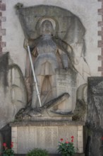 Sculpture of St George with the dragon on a war memorial from both world wars, 1914 to 1918 and