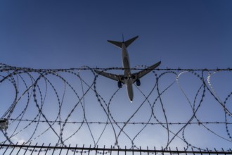 Symbolic image security at the airport, outer fence at Düsseldorf International Airport, steel wire