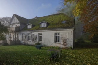 Old manor house, built in 1922, on a misty autumn morning, Othenstorf Estate,