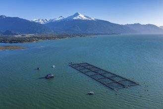 Aerial view of salmon farm in the Reloncavi fjord southeast of Puerto Montt, Chile, South America