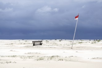 Bank and the flag of Wittdün in Kniepsand, Amrum Island, 27/05/2021