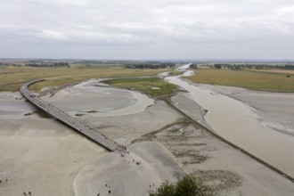 Wide river landscape with bridge and people walking in the distance, Le Mont-Saint-Michel