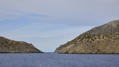 Natural passageway between two steep cliffs overlooking the vast sea, Saria boat tour, Saria