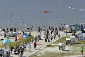 View of the beach promenade with bathing beach, kite surfers on the North Sea, Norddeich, Lower