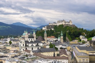 Traditional picture of the old town of Salzburg with the Hohensalzburg Fortress and dense cloud