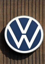 Large VW logo on the old cogeneration plant, Volkswagenwerk Wolfsburg, main plant of Volkswagen AG,