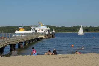 Fjord ferry, ferry dock, sailing boat, beach, people, Falckenstein, Kiel, Schleswig-Holstein,