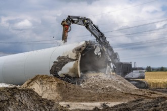 Demolished tower of a 20 year old wind turbine, in the Werl wind farm, 5 old Enercon E-66 turbines