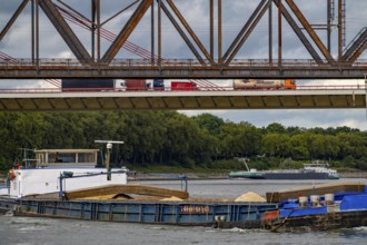 The Beeckerwerth Rhine bridge of the A42 motorway, truck traffic, in front of it the Haus-Knipp