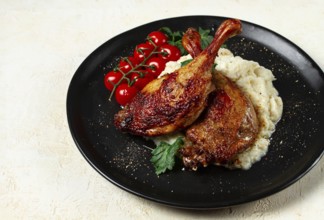 Fried duck shank, cauliflower puree, cherry tomatoes, homemade, no people