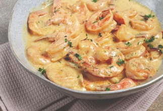 Shrimp in creamy garlic sauce, with spices and herbs