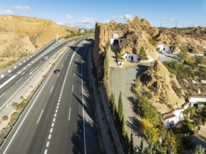 The A-92 highway next to the cave hotel Pedro Antonio de Alarcón in Gudadix. Aerial view. Drone