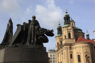 Jan Hus Monument on Old Town Square and the baroque St Nicholas Church, Prague, Czech Republic,