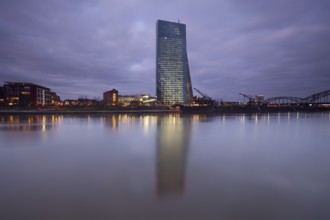 Frankfurt am Main, European Central Bank in the dark. Reflection in the Main