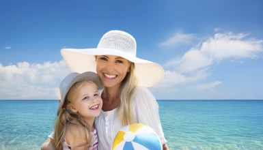 An attractive young woman with her daughter on the beach in the Caribbean, Studio