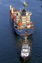 Cargo ship waiting in front of the lock, tugboat, Kiel Canal, Holtenau, Kiel, Schleswig-Holstein,