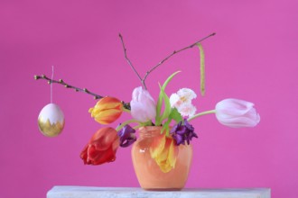 Picturesque still life with flowers and Easter egg, Germany, Europe