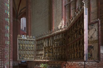 Altar retable from 1430 from St Georgen set up in St Nikolai's Church, late Gothic brick building,