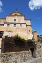 Historic building with architectural details in stone and brick under a blue sky, archive, urban