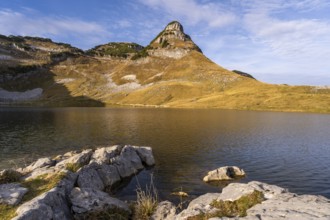 Lake Augstsee and the Atterkogel mountain on the Loser. Rocks in the foreground. Autumn, good