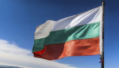 Flags, the national flag of Bulgaria flutters in the wind