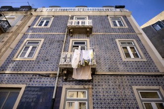 House, house facade, azulejos, tiles, tile decoration, laundry for drying, balcony, Lisbon,