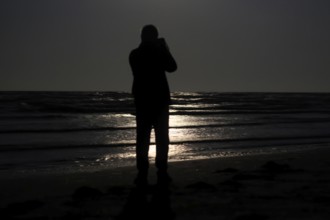 Photographer, Full moon by the sea, Baltic Sea, September, Mecklenburg-Vorpommern, Germany, Europe