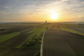 Long fields and a tower in low sun, Jettingen, Black Forest, Germany, Europe