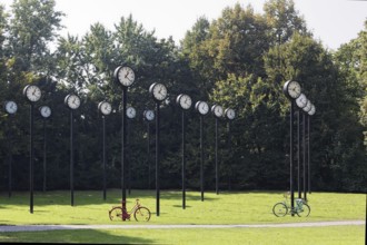 Station clocks with synchronised time, art installation Zeitfeld by Klaus Rinke in the Volksgarten