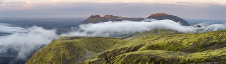 Fog between mountains, moss-covered volcanic mountain landscape, at sunset, Pakgil, Iceland, Europe