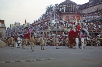 Streets full of people at the annual festival parade, Jaipur, Rajasthan, India, 1971 Elephant