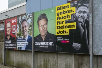 Board with election posters, SPD, CDU, Bündnis90 Die Grünen, FDP, Bundestag election 2025, Kamen,