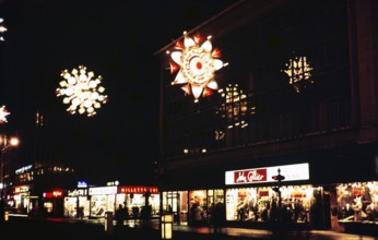 Christmas lights at night on Oxford Street in the centre of London, England, United Kingdom,