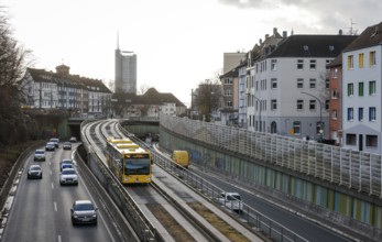 Essen, North Rhine-Westphalia, Germany - Cars and a public bus drive on the A40 motorway through