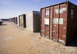 Shipping container with equipment in a storage facility for oil drilling, Dhahran, Arabian Desert,